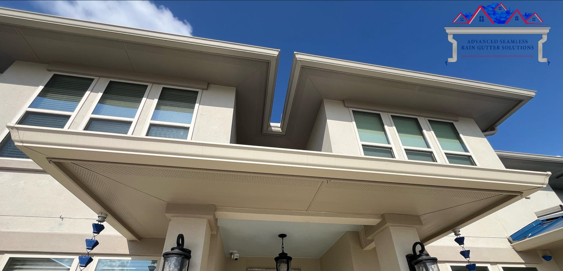 seamless rain gutters installed on two story residential home
